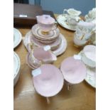 A PINK AND GILT CHINA PART TEA SERVICE, A MAROON AND GILT CHINA PART TEA SERVICE, OF 18 PIECES