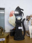 A PAINTED WOOD COCKEREL PATTERN DOOR STOP AND A BLACK METAL CAT PATTERN DOOR STOP (2)