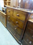 A LARGE VICTORIAN MAHOGANY CHEST OF 2 SHORT OVER THREE LONG DRAWERS, HAVING CURVED CORNERS AND
