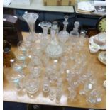 A GOOD SELECTION OF GLASSWARES TO INCLUDE; DECANTERS, FOUR GREEN STEM DRINKING GLASSES, OTHER