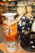 PAIR OF JAPANESE GEISHAS, ONE HOLDING A PIG, 60.9cm HIGH AND A DECORATIVE JAPANESE VASE (as