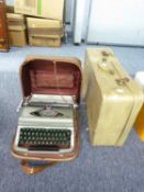 ROYAL MANUAL PORTABLE TYPEWRITER; AND A SMALL SUITCASE (2)