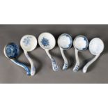 A COLLECTION OF SIX 19TH CENTURY CERAMIC LADLES, mainly early to mid-19th century, though a pair