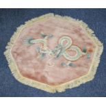 HEAVY QUALITY WASHED CHINESE RUG, octagonal, plain pale pink field with large embossed and multi-
