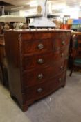A NINETEENTH CENTURY MAHOGANY BOW-FRONT CHEST OF TWO SHORT AND THREE LONG DRAWERS WITH SPIRALLY