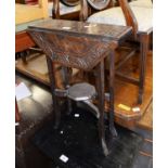 SMALL CARVED DARK OAK OCTAGONAL SUTHERLAND TABLE