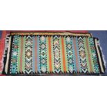 TUNISIAN FLAT WEAVE SMALL, NARROW CARPET, with a horizontal striped design with trios of plain