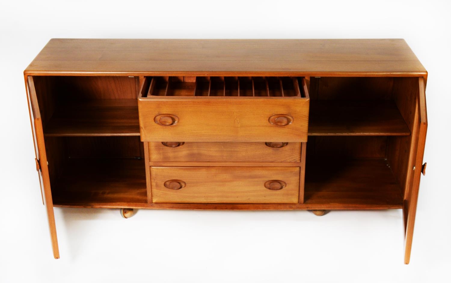 ERCOL LIGHT STAINED ELM SIDEBOARD, the oblong top above a central bank of three drawers, the top - Image 3 of 3