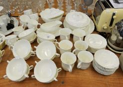 WEDGWOOD COUNTRY WARE, WHITE EMBOSSED PART DINNER SERVICE TO INCLUDE A TUREEN WITH COVER, 12 SOUP