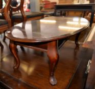 MAHOGANY BEDSIDE CUPBOARD AND A MAHOGANY LARGE OVAL COFFEE TABLE, ON CABRIOLE LEGS