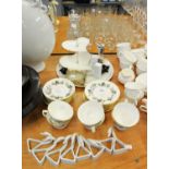 ROYAL WORCESTER PART TEA SERVICE OF 6 CUPS, 8 SAUCERS, 9 SIDE PLATES; WHITE PORCELAIN NAPKIN