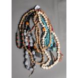 CONTINUOUS SINGLE STRAND NECKLACE, THE BEADS FORMED BY PAIRS OF SMALL SEA SHELLS AND NINE VARIOUS