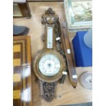 ANEROID BAROMETER, MILL SHUTTLE, AND MARTINGALE OF HORSE BRASSES (3)