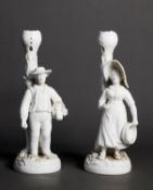 PAIR OF NINETEENTH CENTURY DERBY WHITE GLAZED PORCELAIN FIGURAL CANDLESTICKS, modelled as a rustic