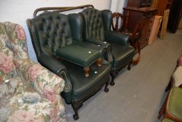 PAIR OF GREEN LEATHER WINGED BACK BUTTONED ARMCHAIRS ON CARVED FRONT LEGS AND A GREEN LEATHER