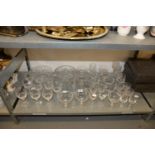 A GOOD SELECTION OF CUT GLASS WINE GLASSES, BRANDY BALLOONS, WHISKY GLASSES AND TWO CUT GLASS