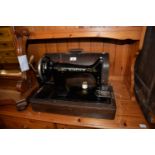 SINGER PORTABLE SEWING MACHINE IN OAK DOME CASE