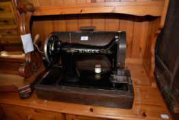 SINGER PORTABLE SEWING MACHINE IN OAK DOME CASE