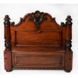 NINETEENTH CENTURY HEAVY CARVED MAHOGANY FOOTBOARD FOR A HALF TESTER BED, with well carved shell