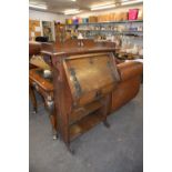 ARTS & CRAFTS OAK SMALL BUREAU, WITH ORNATE BRONZE STRAP WORK, SLOPING FALL FRONT, ONE LONG