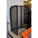 TRIPTYCH SPARK GUARD WITH BLACK METAL FRAME AND MESH PANELS