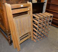TWO WOODEN FOLD-FLAT SINGLE CHAIRS AND A WOOD AND METAL WINE RACK