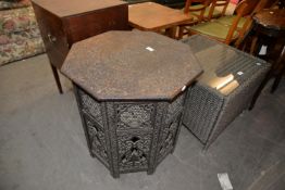 PROFUSELY CARVED FOLDING TABLE WITH OCTAGONAL TOP