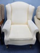 LAURA ASHLEY WINGED EASY ARMCHAIR, ALL-UPHOLSTERED AND COVERED IN WHITE WOVEN FABRIC, ON SHORT