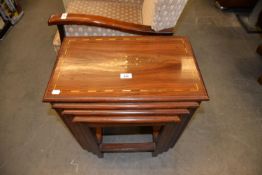 NEST OF FOUR MAHOGANY COFFEE TABLES HAVING BRASS INLAY INSERT