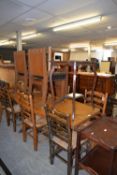 TOMBEAU SHAPED DINING TABLE AND A SET OF FOUR OAK PURITAN CHAIRS WITH LEATHER SEATING (5)