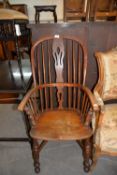 A COUNTRY WINDSOR ARMCHAIR, WITH CRINOLINE STRETCHER