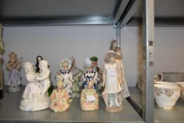 TWO PAIRS OF NODDING BISQUE FIGURES, 18cm HIGH, A PAIR OF SMALLER NODDING BISQUE FIGURES, 10cm HIGH,