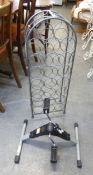 GREY METAL WIRE PATTERN ARCH SHAPED WINE RACK FOR 29 BOTTLES AND A UNDERTABLE PEDAL EXERCISER (2)