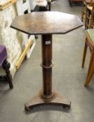 WILLIAM IV MAHOGANY OCTAGONAL JARDINIÈRE STAND, ON COLUMN AND TRIFORM PLATFORM BASE, WITH PAD