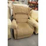 A MODERN UPHOLSTERED RECLINING ARMCHAIR, COVERED IN FAWN COLOURED FABRIC WITH ELECTRIC WORKS