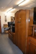 A MID-CENTURY MEDIUM OAK BEDROOM SUITE OF TWO PIECES, VIZ, A GENT’S SEMI-FITTED WARDROBE AND A