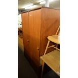 A MID-CENTURY TEAK TWO-DOOR WARDROBE AND A TEAK AND WHITE MELAMINE LONG, LOW DRESSING TABLE WITH