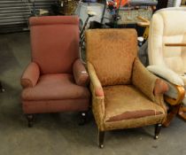 AN ANTIQUE UPHOLSTERED FIRESIDE ARMCHAIR WITH TURNED FRONT SUPPORTS AND ANOTHER HAVING SQUARE