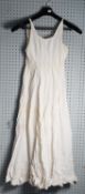 EARLY VICTORIAN PLEATED WHITE LAWN CHEMISE with narrow lace stripes decorating the bodice and