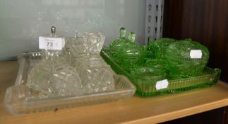 TWO ART DECO AND LATER PRESSED GLASS DRESSING TABLE VANITY SETS, ONE IN GREEN THE OTHER CLEAR [QTY]
