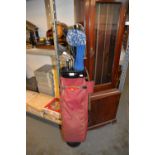 A GOLF BAG AND A SET OF STEEL-SHAFTED GOLF CLUBS