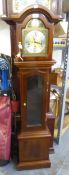 A MODERN MAHOGANY GRANDDAUGHTER CLOCK WITH 8 DAYS SPRING DRIVEN STRIKING AND CHIMING MOVEMENT,
