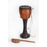 AFRICAN PAINTED WOODEN HIDE AND ANIMAL SKIN PEDESTAL DRUM, together with a wooden handled HIDE AND