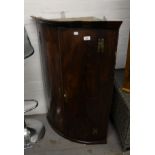 GEORGIAN OAK BOW FRONTED HANGING CORNER CUPBOARD