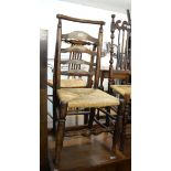 AN OAK WINDSOR COUNTRY STYLE LADDER-BACK DINING CHAIR, WITH RUSH SEAT, HAVING TURNED CROSS STRETCHER