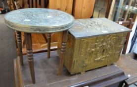 A SMALL ROUND BRASS TOPPED TABLE AND A BRASS EMBOSSED LOG BOX (2)