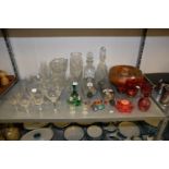 A SELECTION OF GLASSWARES TO INCLUDE; VARIOUS WINE/SHERRY GLASSES, CUT GLASS VASES, DECANTERS AND