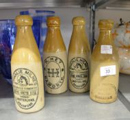 FOUR ANTIQUE STONEWARE GINGER BEER BOTTLES; HALIFAX BOTTLING CO., H. HEY OF HOWARTH AND TWO
