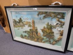 A LARGE SHELL RELIEF PICTURE OF A MOUNTAINOUS AREA WITH STORKS AND PAGODAS IN DEEP BLACK FRAME 51" X