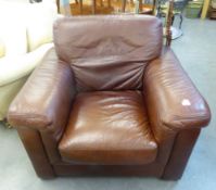 A LARGE BROWN LEATHER LOUNGE CHAIR